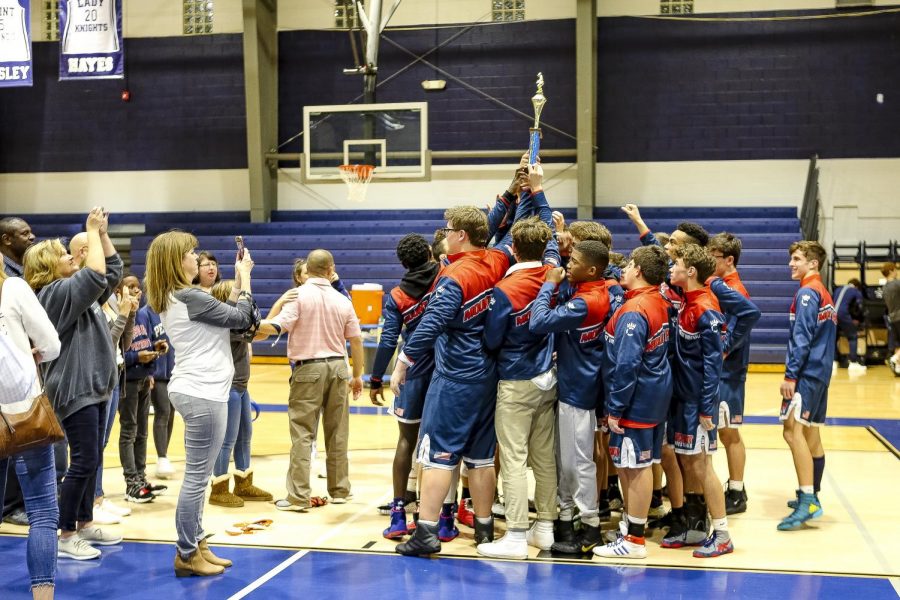 The team celebrating their victory