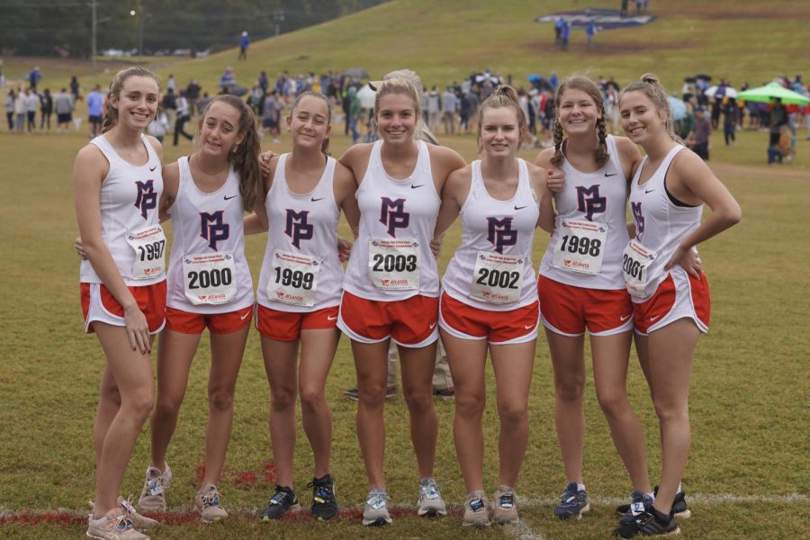 Staff writer Jenna Culpepper (second from right) with her Varisty cross country team at their state meet
