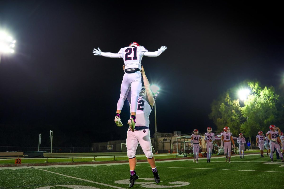 Ingalls and freshman Andrew Holloway celebrate Pisgah’s last win before playoffs.